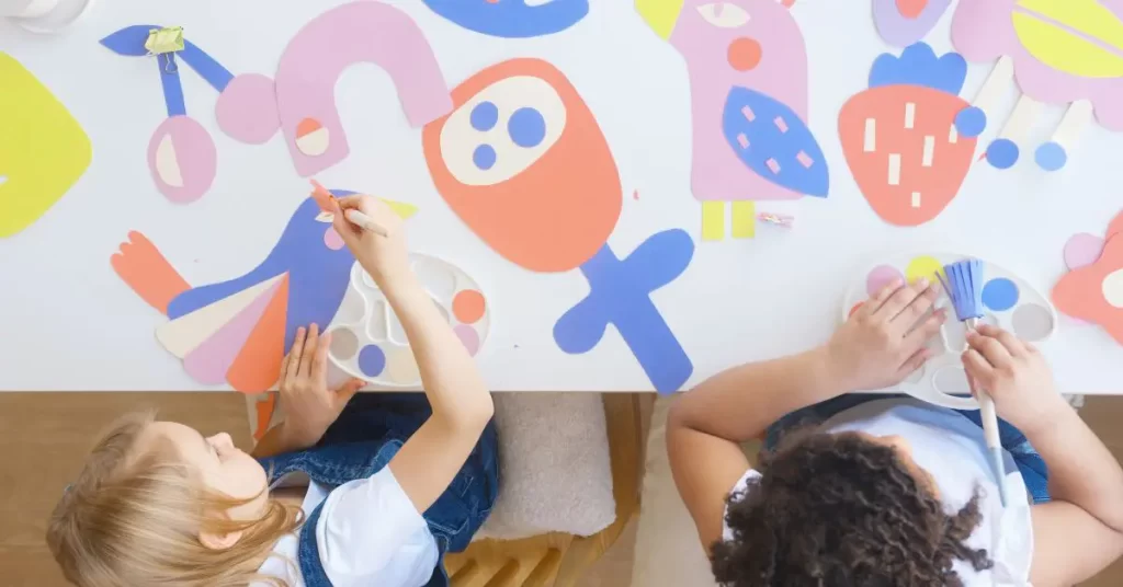 two girls making Children's artwork