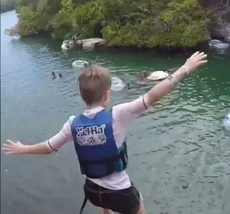 boy cliff jumping