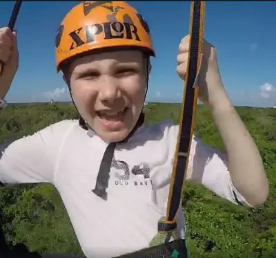 My son getting out of his comfort zone by ziplining