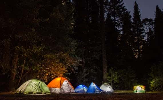a group of tents at night