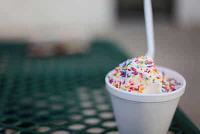 Ice cream in a cup with sprinkles