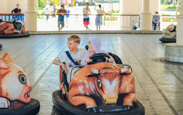 boys in a bumper car