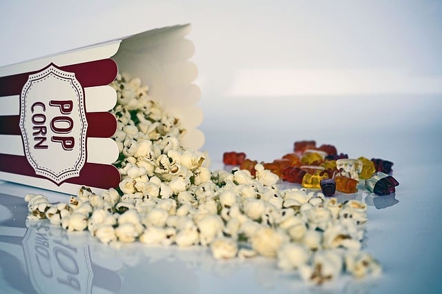 a pile of popcorn with a red and white box