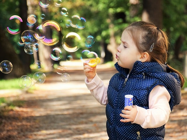 An image of a little girl spending free-time before school term starts.