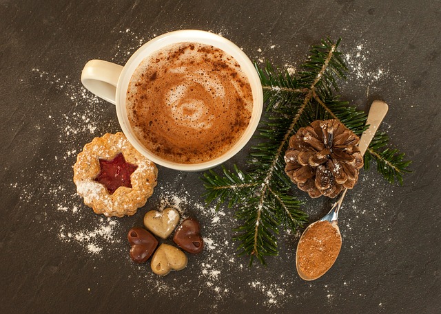 cut of hot chocolate on a table with cookies