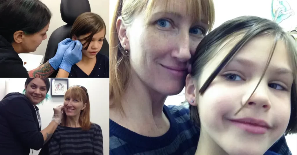 Mother and daughter getting ears pierced at a tattoo shop