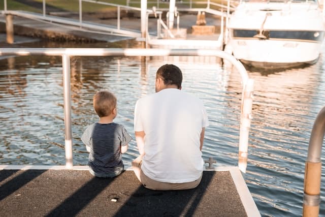 son and father talking about back to school during covid