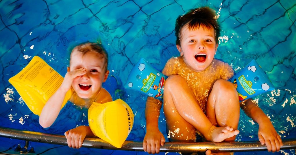 Children swimming in the summer