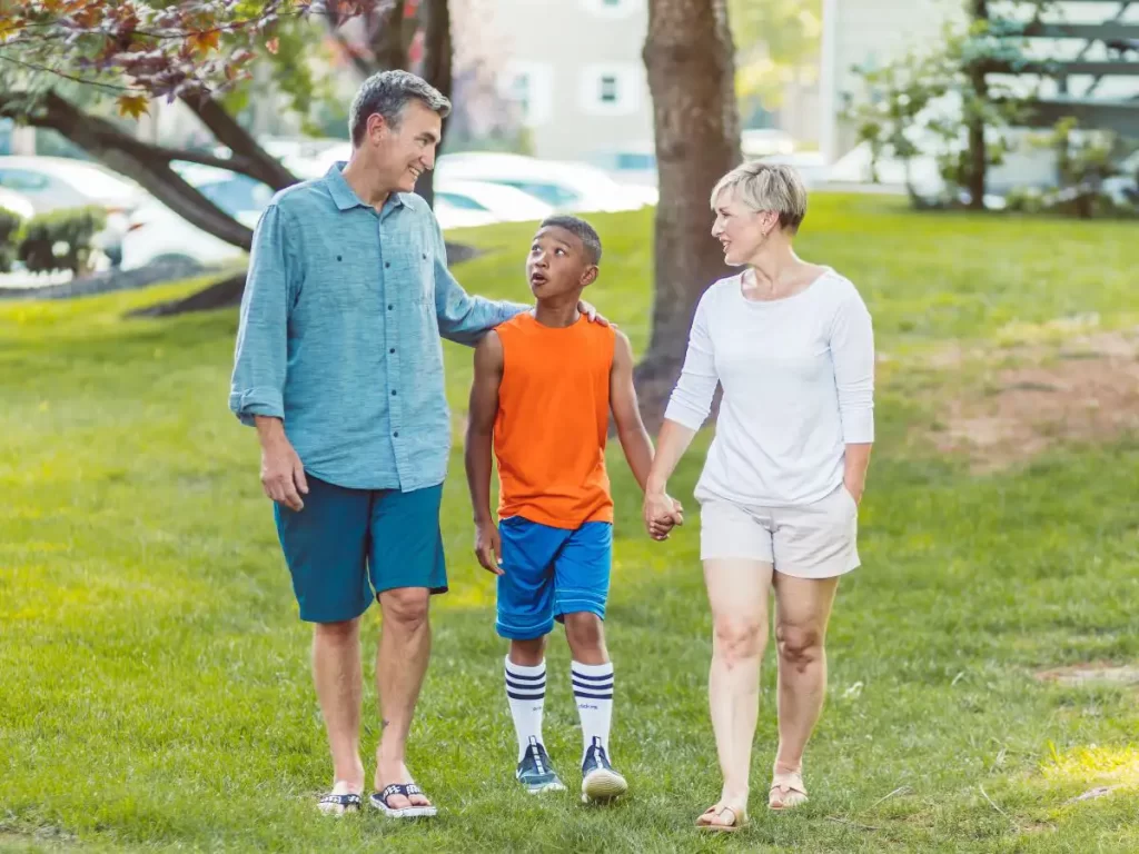 Parents walking with child