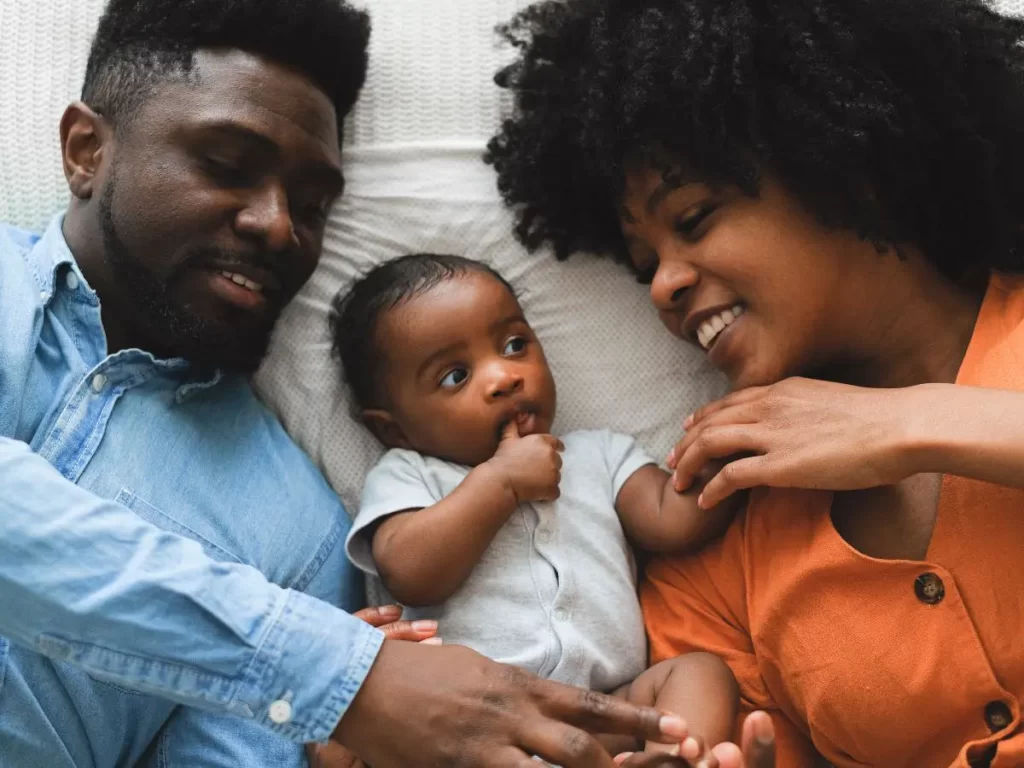 Mom and dad signing with baby