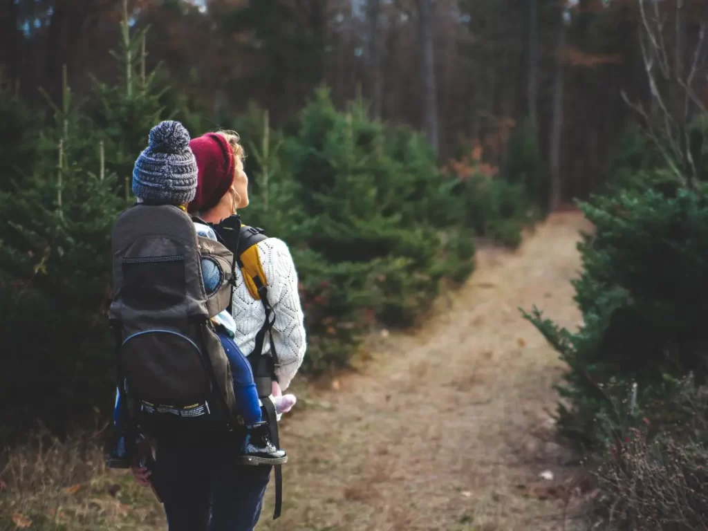 Paren Hiking with child in a backpack