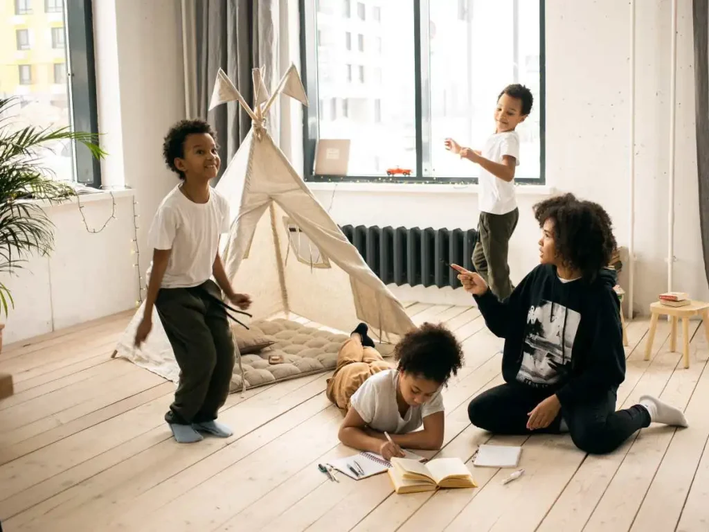 kids making a tent fort and playing