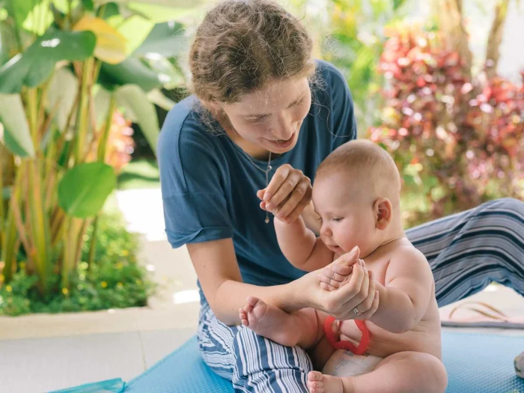 mom playing with baby