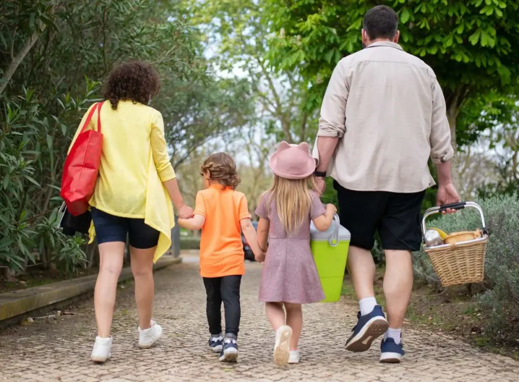 parents and kids going on a walk